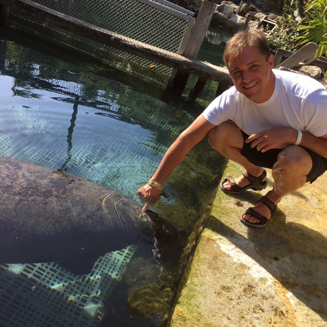 Man and a manatee.